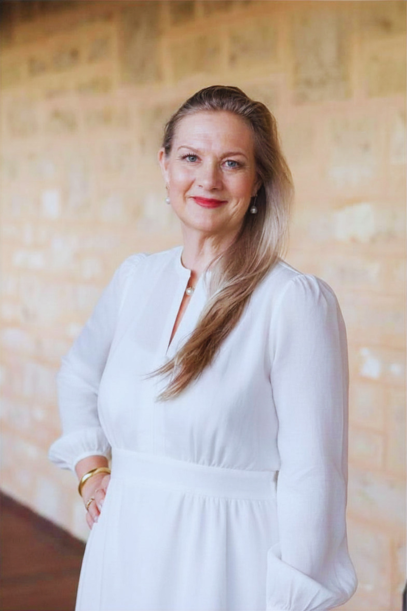 Fiona Cooper Smyth - Harmony Sanctuary Therapist in white dress